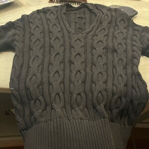 Cable knit v neck sweater.